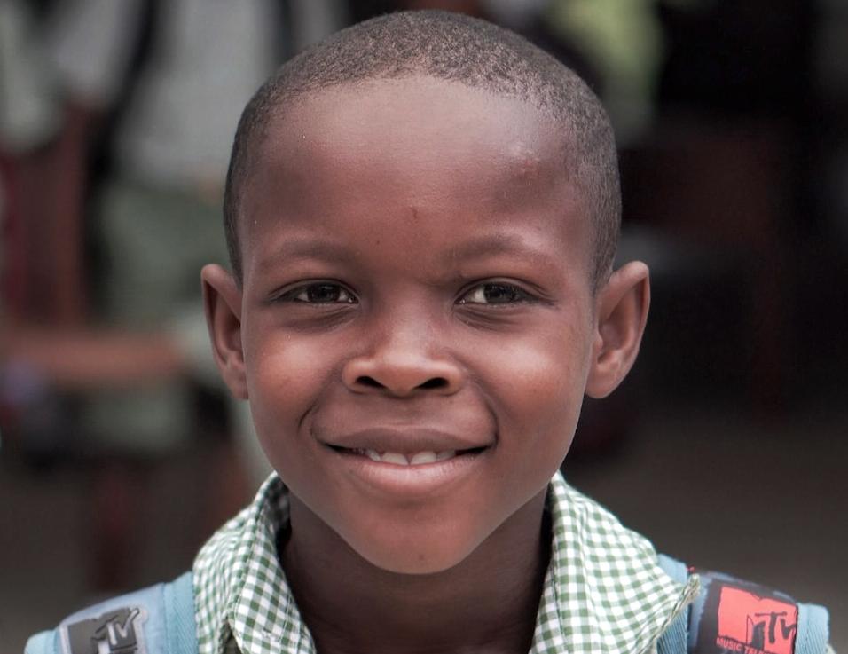 boy wearing blue backpack